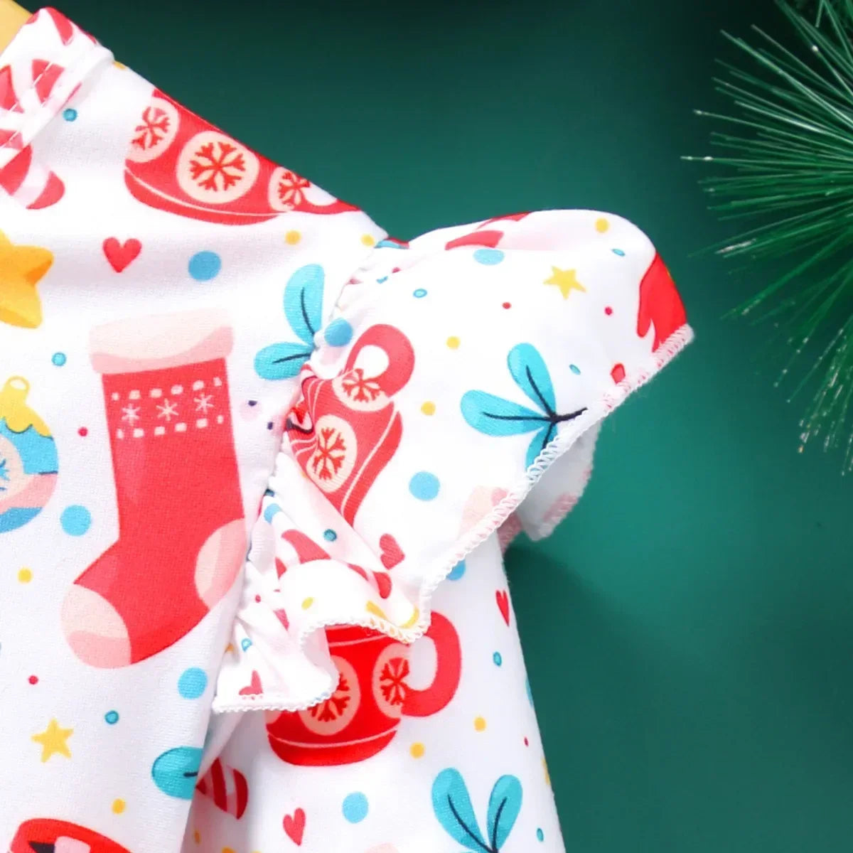 close-up of winged shoulder ruffle on girls christmas a-line dress, festive holiday outfit detail for kids