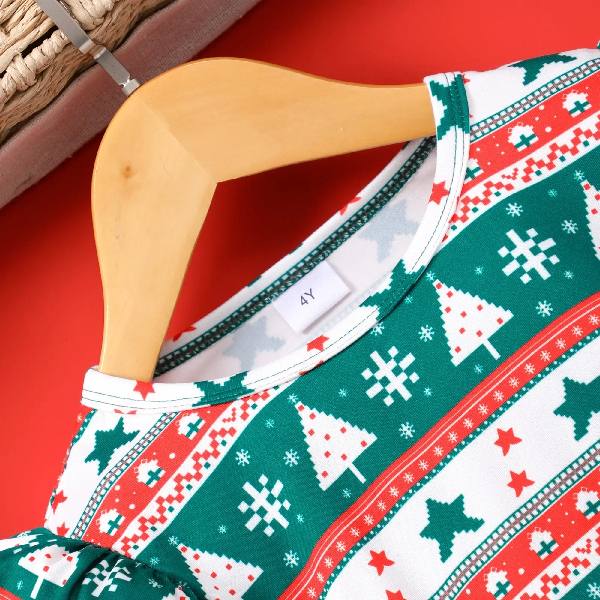 close-up of collar on girls green christmas dress, soft fabric and festive stitching detail