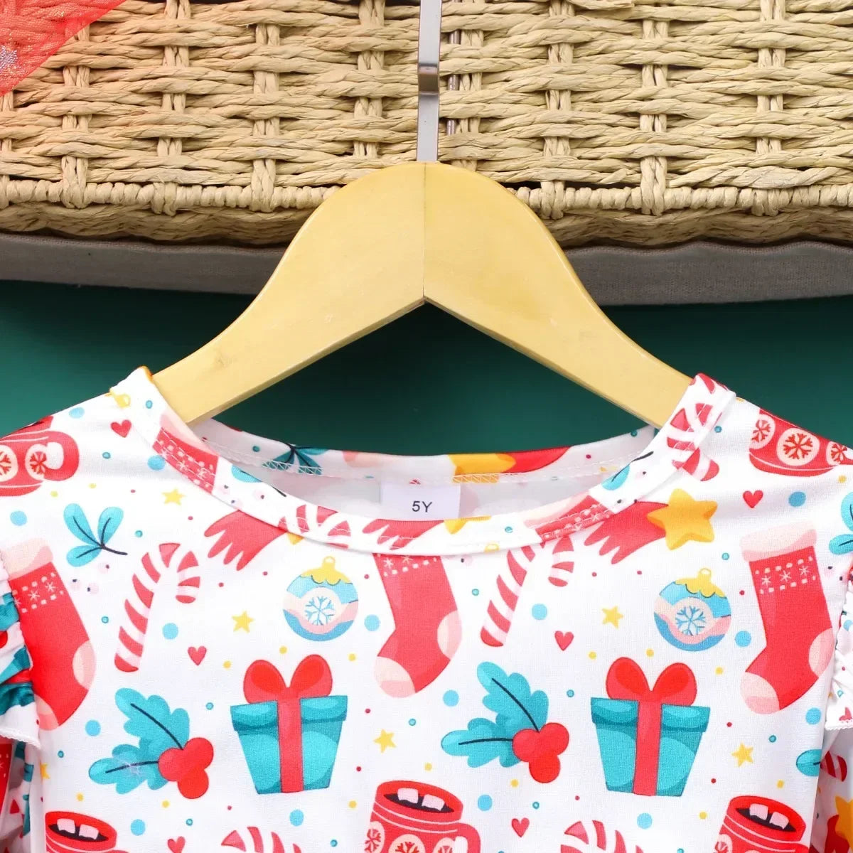 close-up of collar on girls red christmas dress showing soft fabric and festive stitching detail